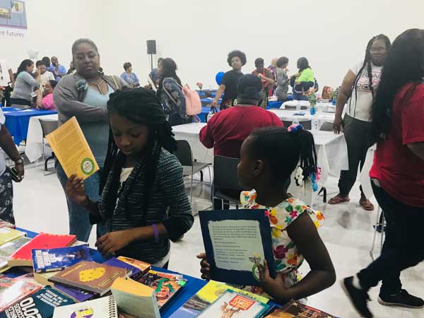 student-recognition-ceremony-girls-picking-books